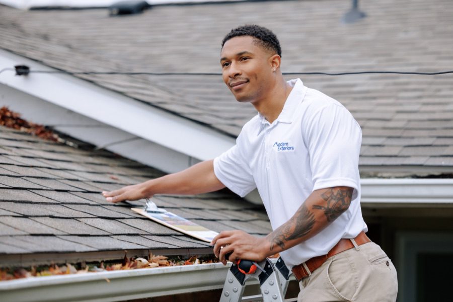 Residential house with professionally installed shingle roof, roofing installation and repair services