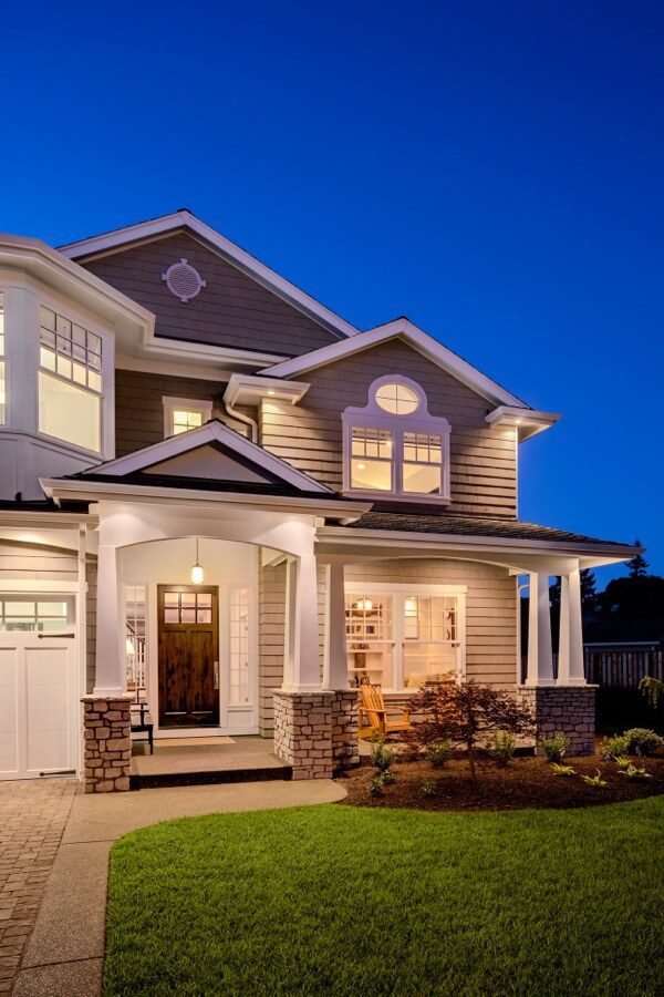 Professional roofing contractor greeting homeowner, residential roof installation and maintenance services