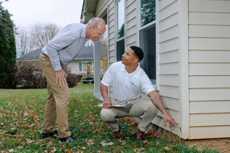 Residential house with professionally installed shingle roof, roofing installation and repair services